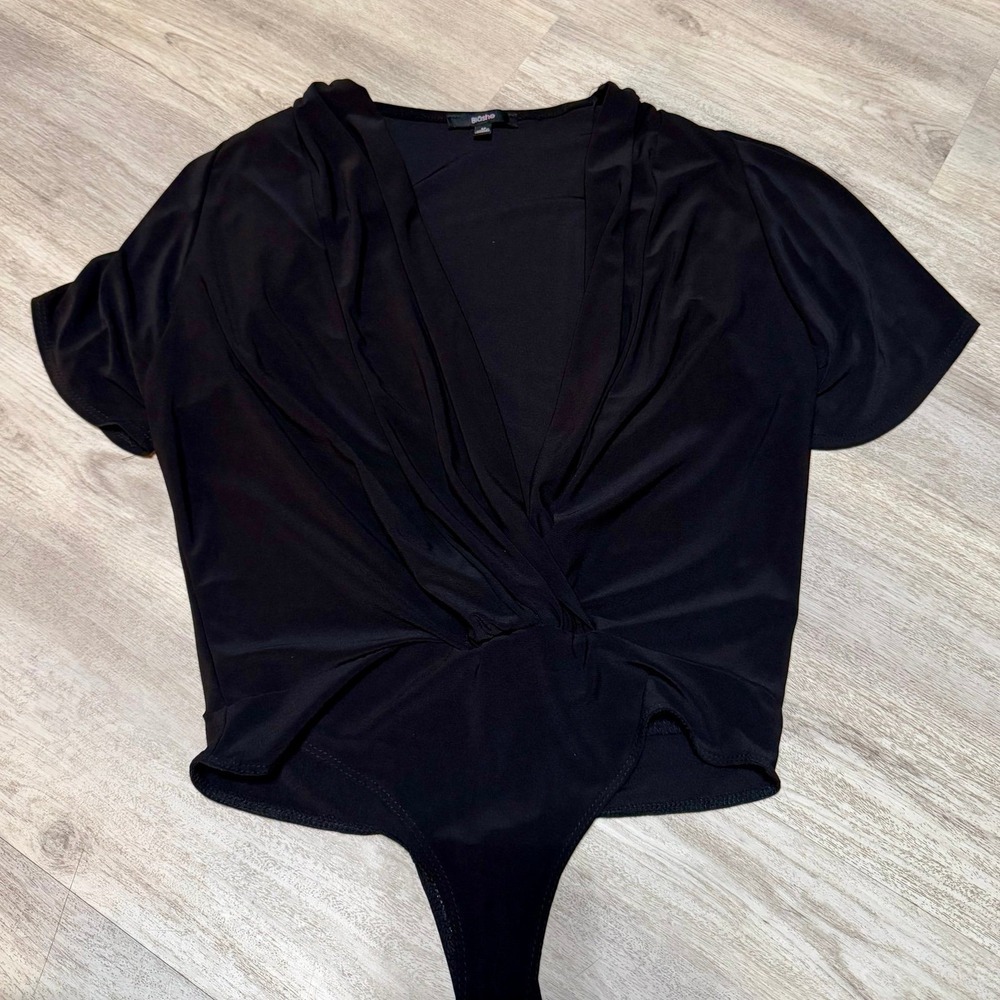 Deep V cut black Bodysuit size medium 95% polyester 5%‎ spandex